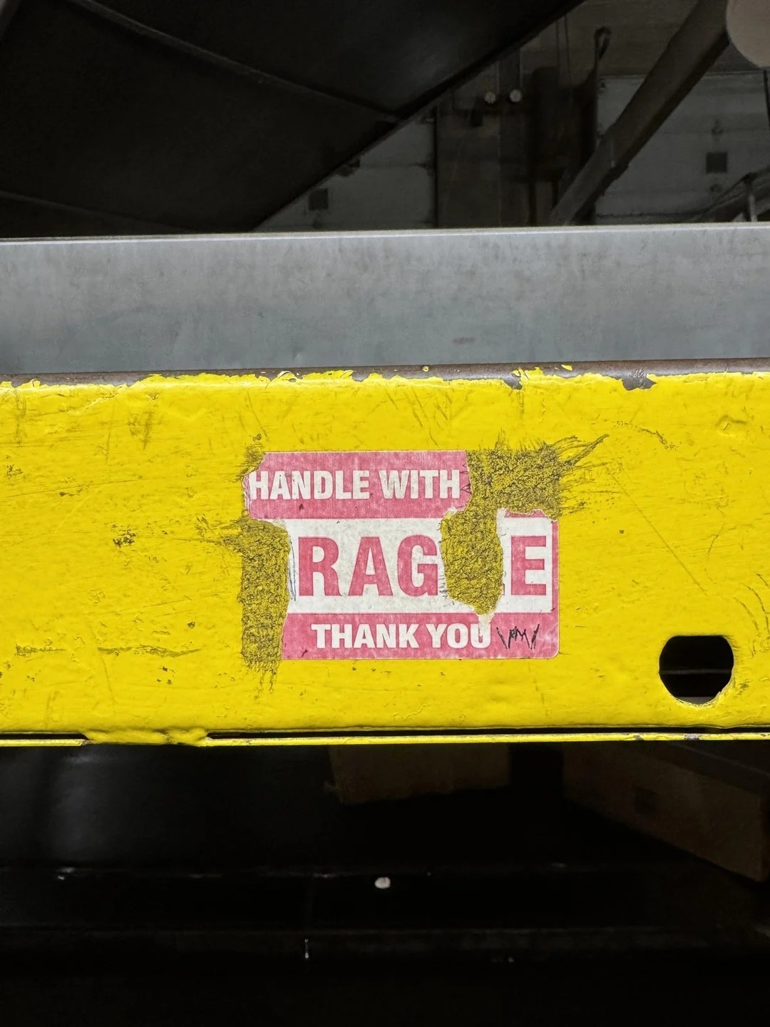 Worn out sign saying handle with rage